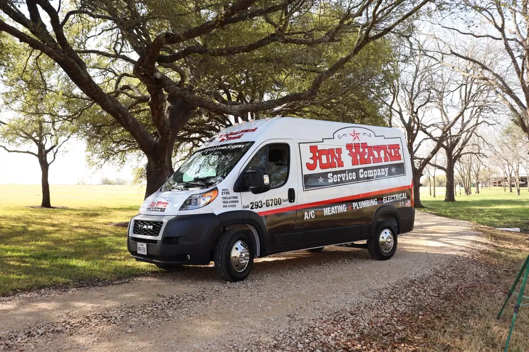 Jon Wayne HVAC Technician in front of Truck