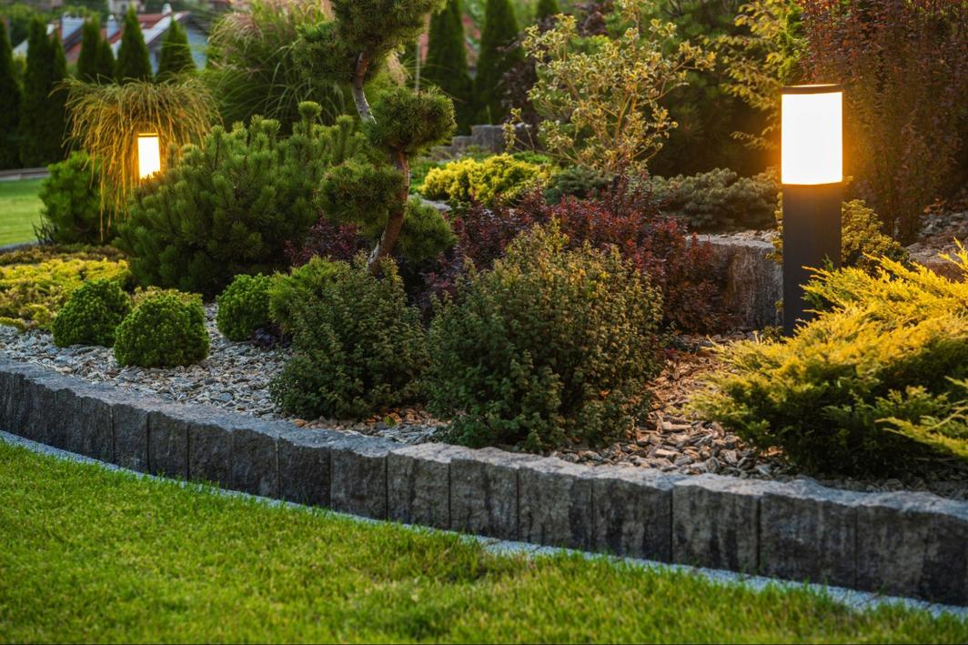 Modern LED lighting on manicured landscaping outside a residential home.