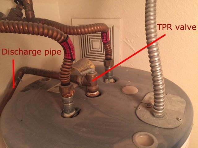 The discharge pipe and TPR valve on a tank water heater