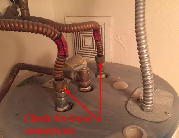 cold water inlet and hot water outlet pipes on a tank water heater