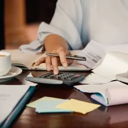 Woman filling out bills