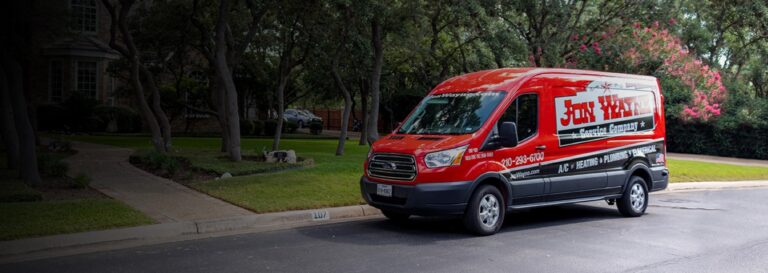A Jon Wayne service truck on a road.